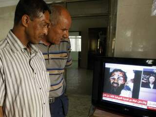 Foto de suposto Osama morto aparece na TV. (Foto: AFP)