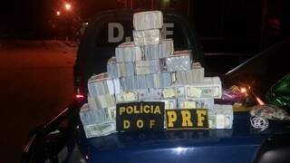 Maços de dólares foi depositado em uma conta, pela Polícia Federal. (Foto: Divulgação/DOF)
