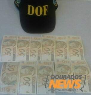 Foram apreendidas 11 cédulas falsas de R$ 50, que totaliza R$ 550. (Foto: Divulgação/Dourados News)