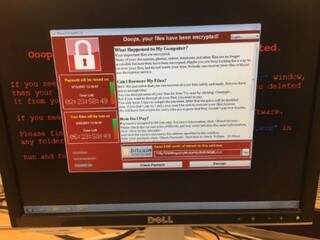 Mensagem que aparece na tela de computadores invadidos.(Foto: Reprodução/ Exame)