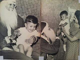 Bebê Nelsinho chorando no colo de Papai Noel e depois acalmado pela mãe (Foto: Facebook)
