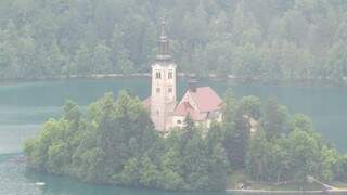 Igrejas e castelos compõem vista em meio ao lago &quot;Bled&quot;. (Foto: Arquivo Pessoal)