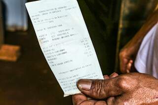 Extrato do dinheiro que sobrou do auxílio depois de compra de família em Campo Grande (Foto: Arquivo/Kisie Ainoã)