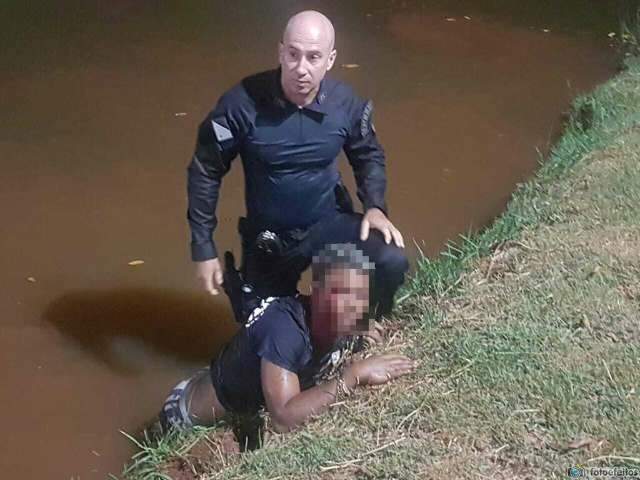 PM salva adolescente que se afogava em lago ap&oacute;s apanhar de dupla