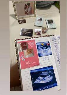 Caderno com fotos da gravidez e do exame de ultrassom. (Foto: Arquivo pessoal)