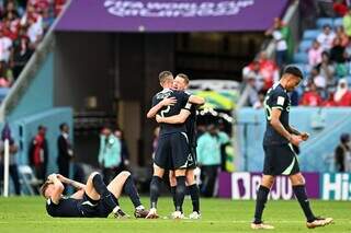 Jogadores da Austrália comemorando a primeira vitória na Copa do Mundo (Foto: Divulgação/FIFA)