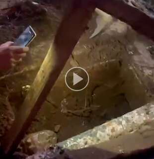 Vizinhos fazem mutirão para limpar boca de lobo tampada na Vila Nasser