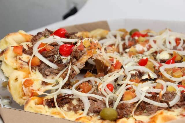 Feita em fam&iacute;lia, pizza tem creme especial que conquistou bairro
