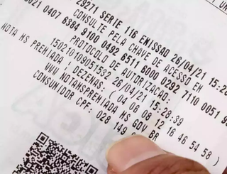 Nota fiscal com o CPF cadastrado; número é usado em sorteios realizados pelo Governo do Estado. (Foto: Arquivo/Campo Grande News)