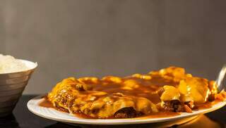 Filé à parmegiana virou febre em restaurantes e no delivery Filé à parmegiana virou febre em restaurantes e no delivery