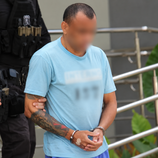 Exame de ex-l&iacute;der de fac&ccedil;&atilde;o tem escolta pesada e bloqueio de rua